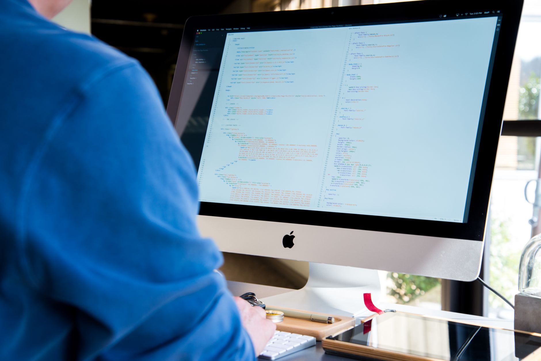 Software developer writing code on a computer screen